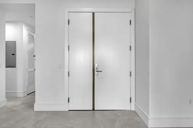 a view of a kitchen with kitchen island a large window