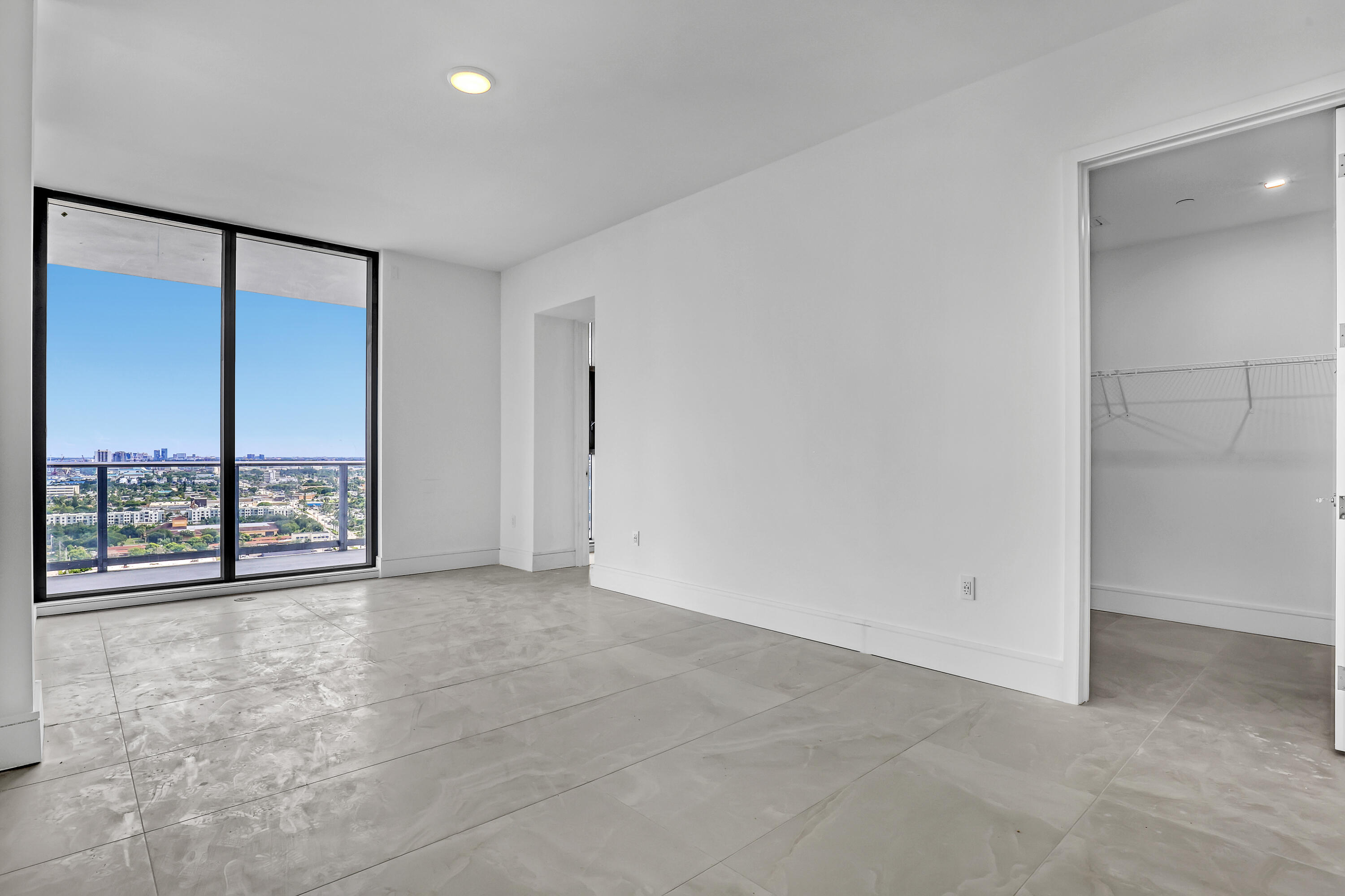 220 Lake Shore Drive, Unit N2103 Lake Park, FL 33403 - Photo 46 of 57 an empty room with sliding glass door and shower