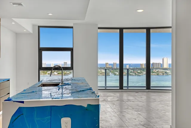 a kitchen with stainless steel appliances a refrigerator and a stove top oven