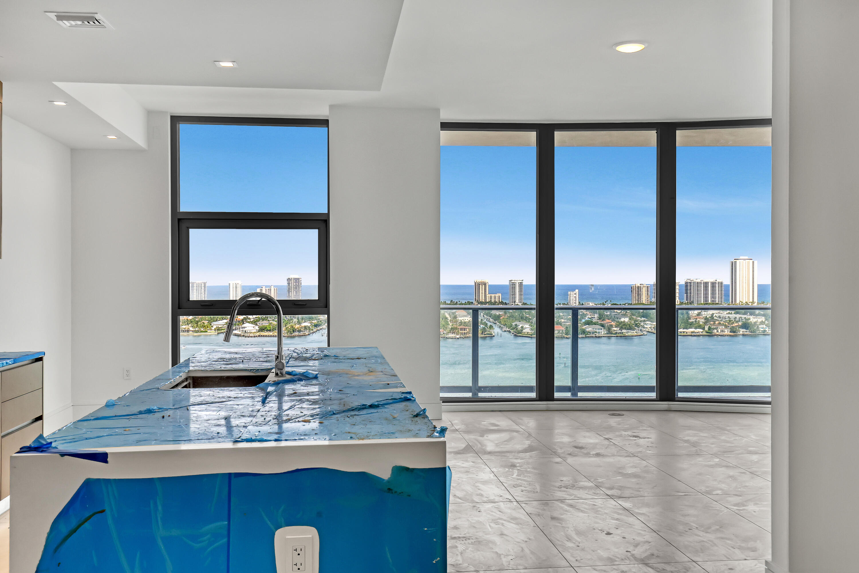 220 Lake Shore Drive, Unit N2103 Lake Park, FL 33403 - Photo 6 of 57 a view of a kitchen with kitchen island a large window