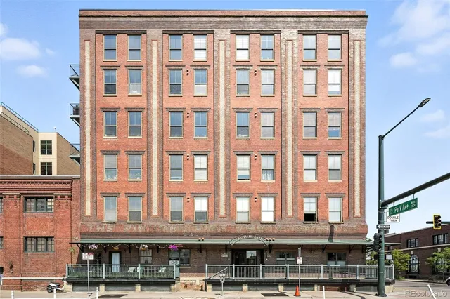 a front view of a building with a glass windows