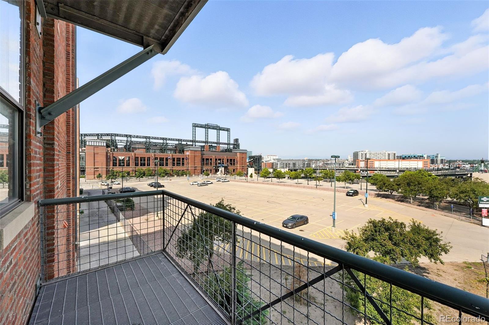 2261 Blake Street, Unit 3E Denver, CO 80205 - Photo 19 of 46 a view of swimming pool with a balcony