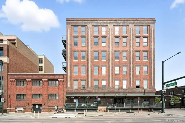 a front view of a building with a street