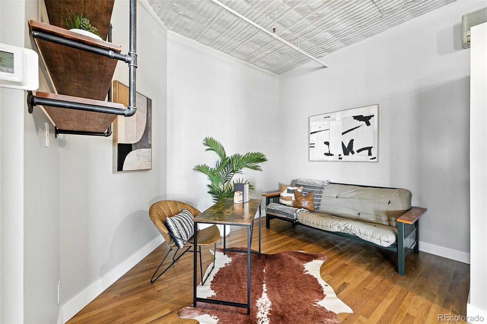 2261 Blake Street, Unit 3E Denver, CO 80205 - Photo 23 of 46 a living room with furniture