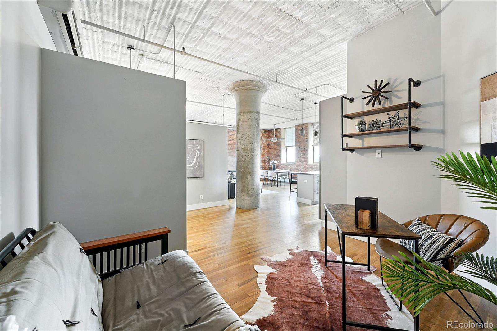 2261 Blake Street, Unit 3E Denver, CO 80205 - Photo 24 of 46 a living room with furniture and a table