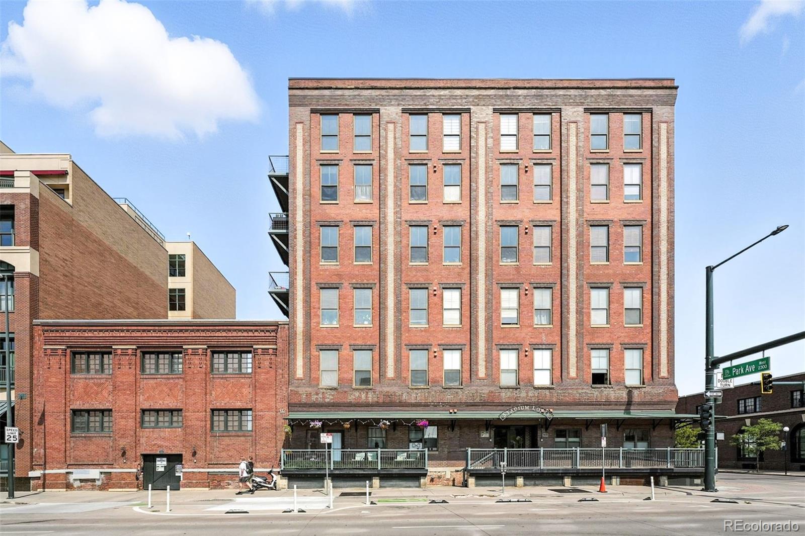 2261 Blake Street, Unit 3E Denver, CO 80205 - Photo 3 of 46 a front view of a building with a street