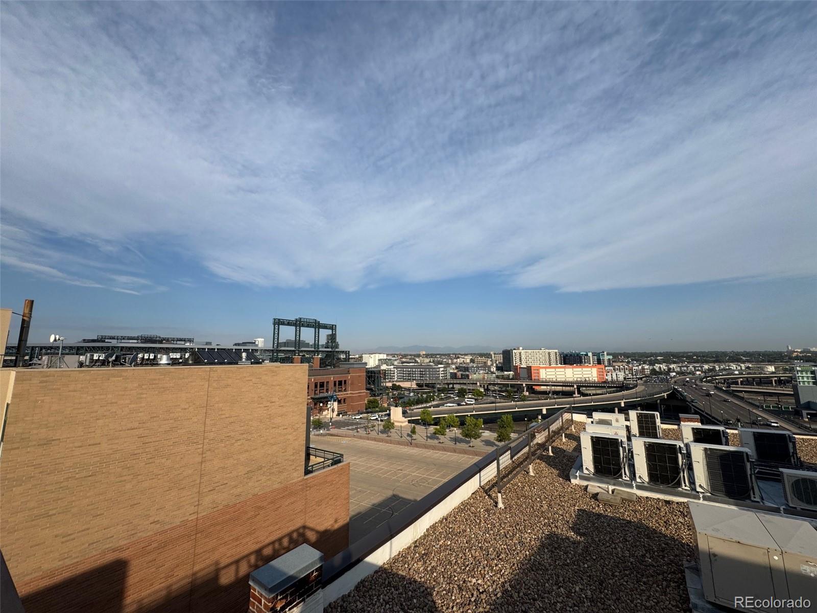 2261 Blake Street, Unit 3E Denver, CO 80205 - Photo 46 of 46 a view of a lake with a city