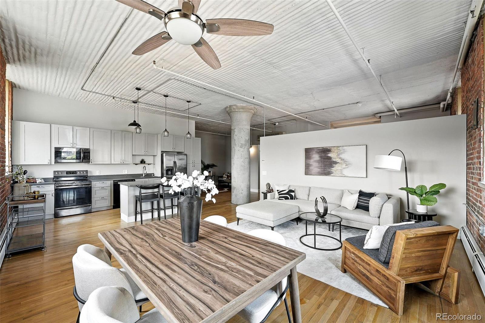 2261 Blake Street, Unit 3E Denver, CO 80205 - Photo 8 of 46 a living room with lots of furniture and view of kitchen