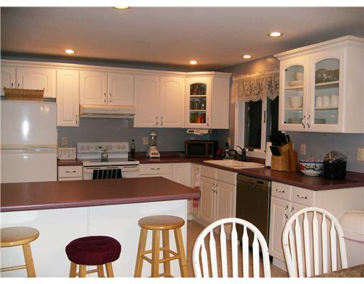 118 Garvin Road, Unit ROAD Acton, ME 04001 - Photo 3 of 19 Kitchen. Breakfast bar with modern...