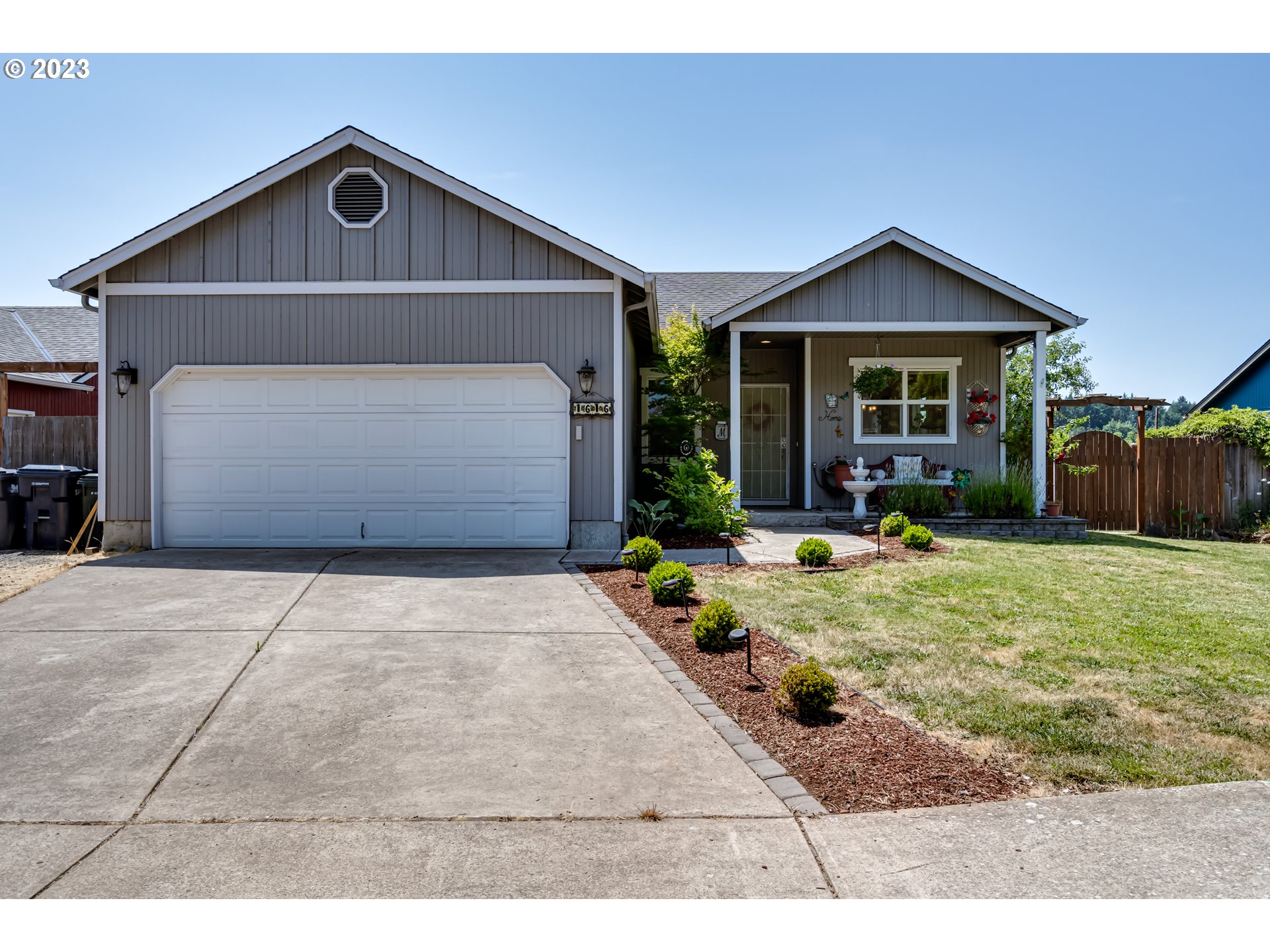 1616 South 59th Street Springfield, OR 97478 - Photo 1 of 44 a front view of a house with garden