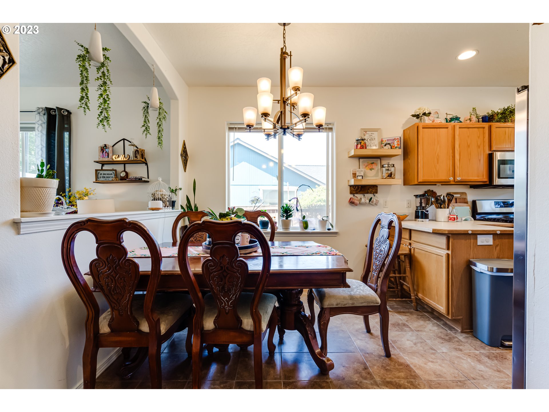 1616 South 59th Street Springfield, OR 97478 - Photo 15 of 44 a view of a dining room with furniture and a chandelier