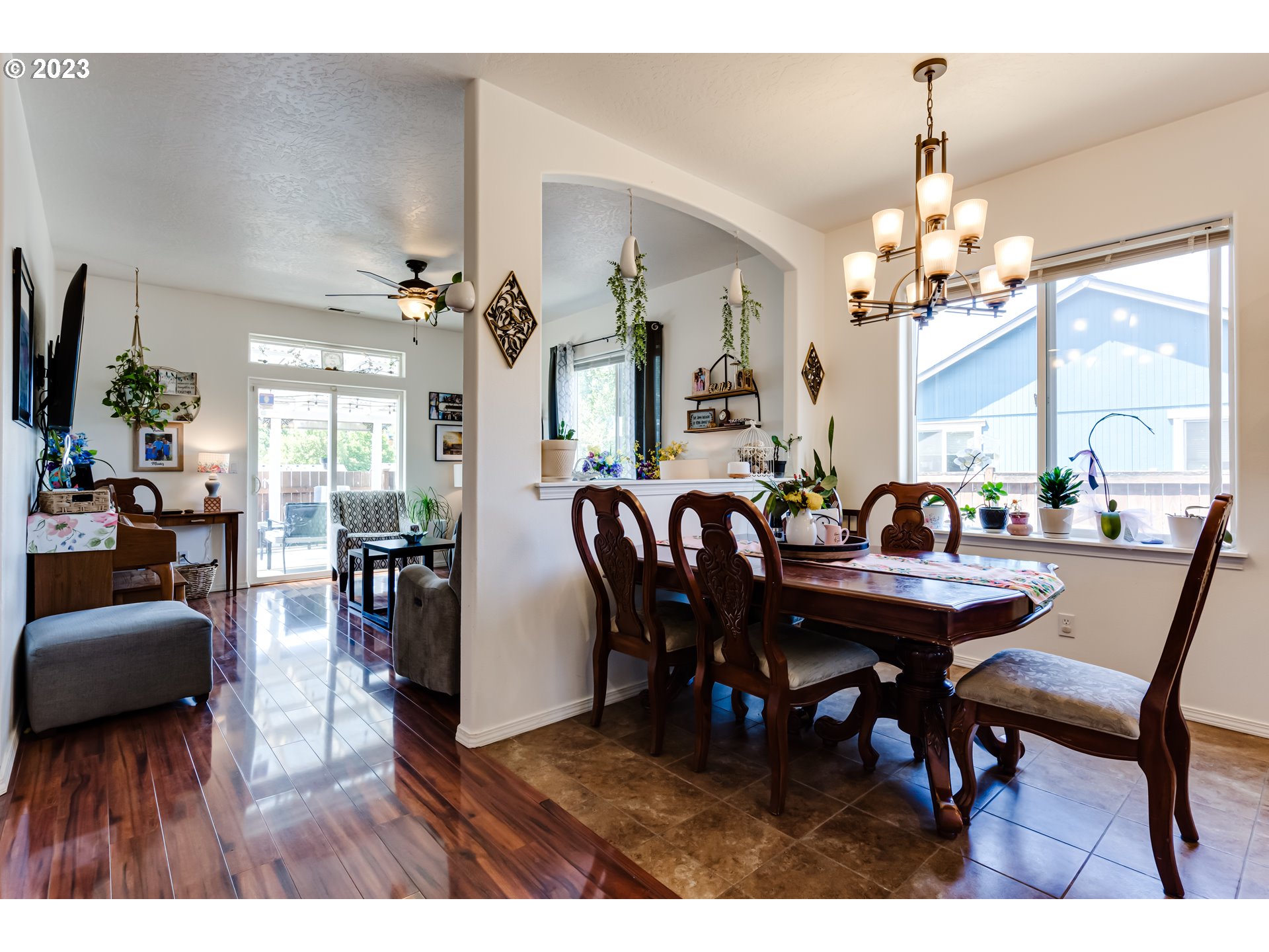 1616 South 59th Street Springfield, OR 97478 - Photo 16 of 44 a view of a dining room with furniture and a chandelier