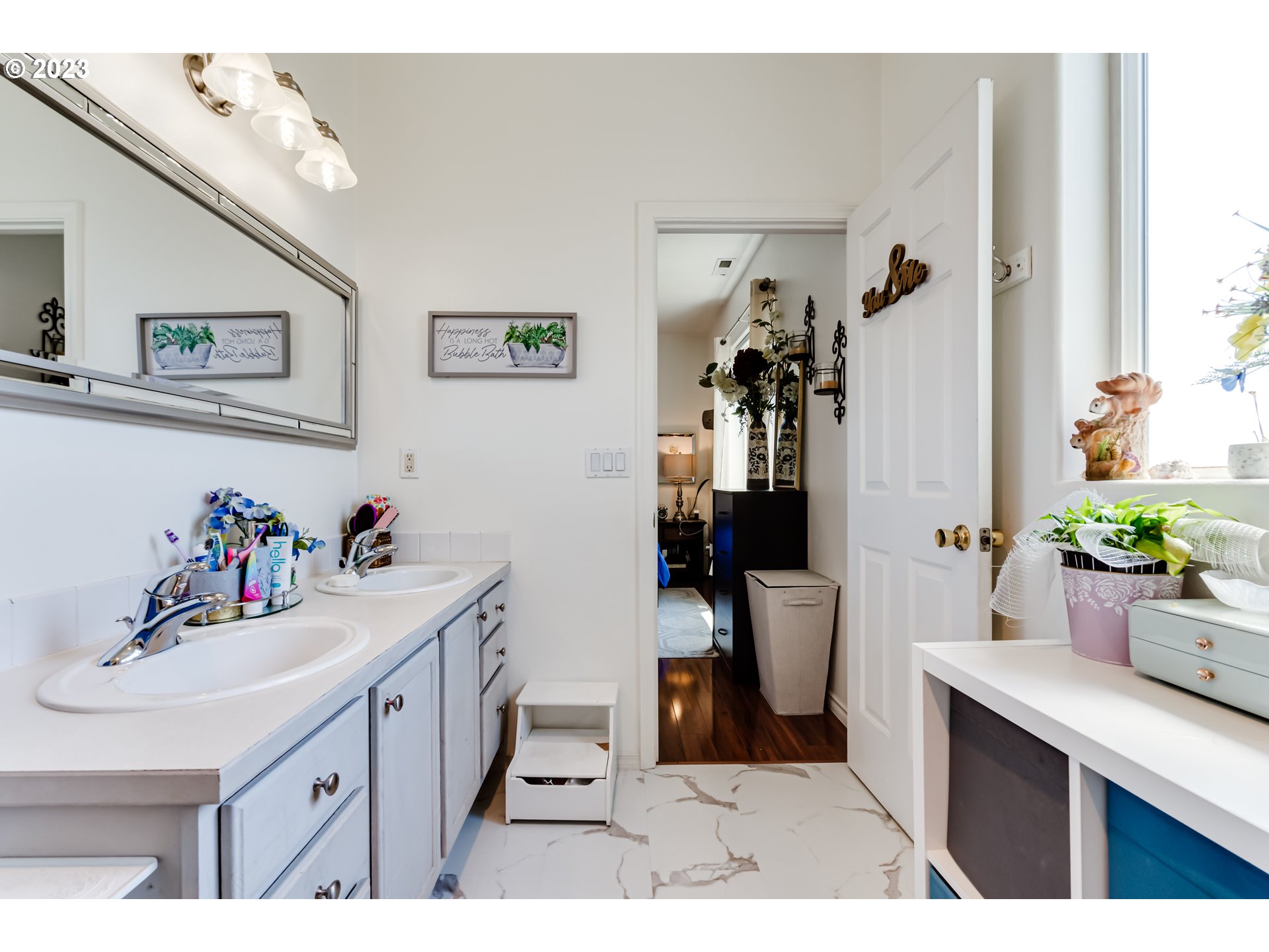 1616 South 59th Street Springfield, OR 97478 - Photo 29 of 44 a bathroom with a sink a mirror and a toilet