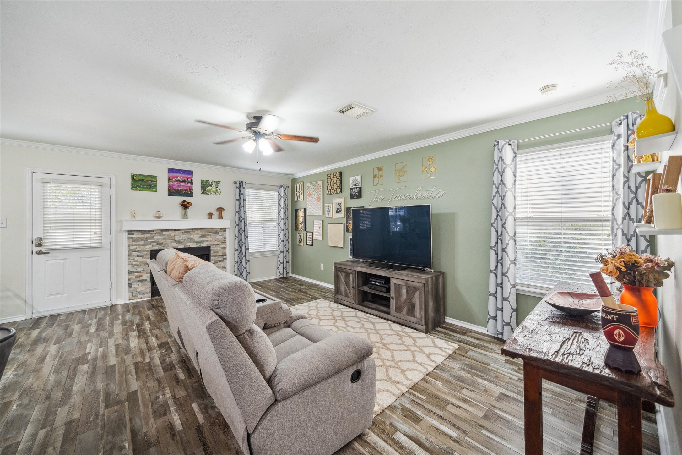 38 Wineberry Place Spring, TX 77382 - Photo 17 of 32 a living room with furniture a flat screen tv and a window