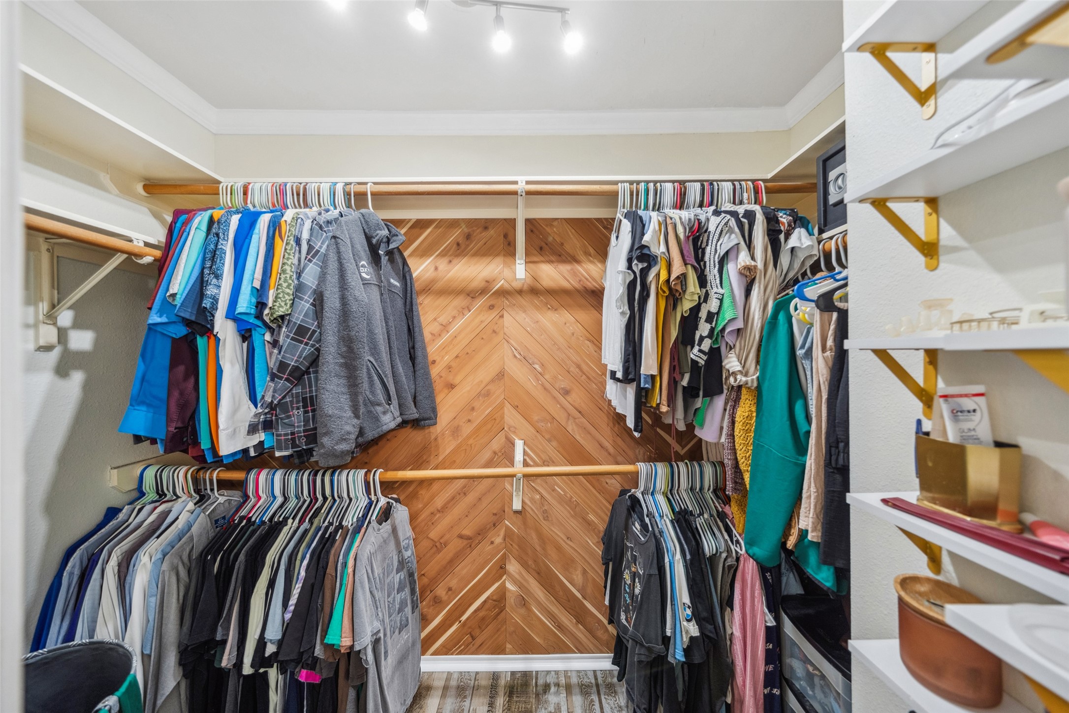38 Wineberry Place Spring, TX 77382 - Photo 24 of 32 a view of walk in closet with clothes and shoes