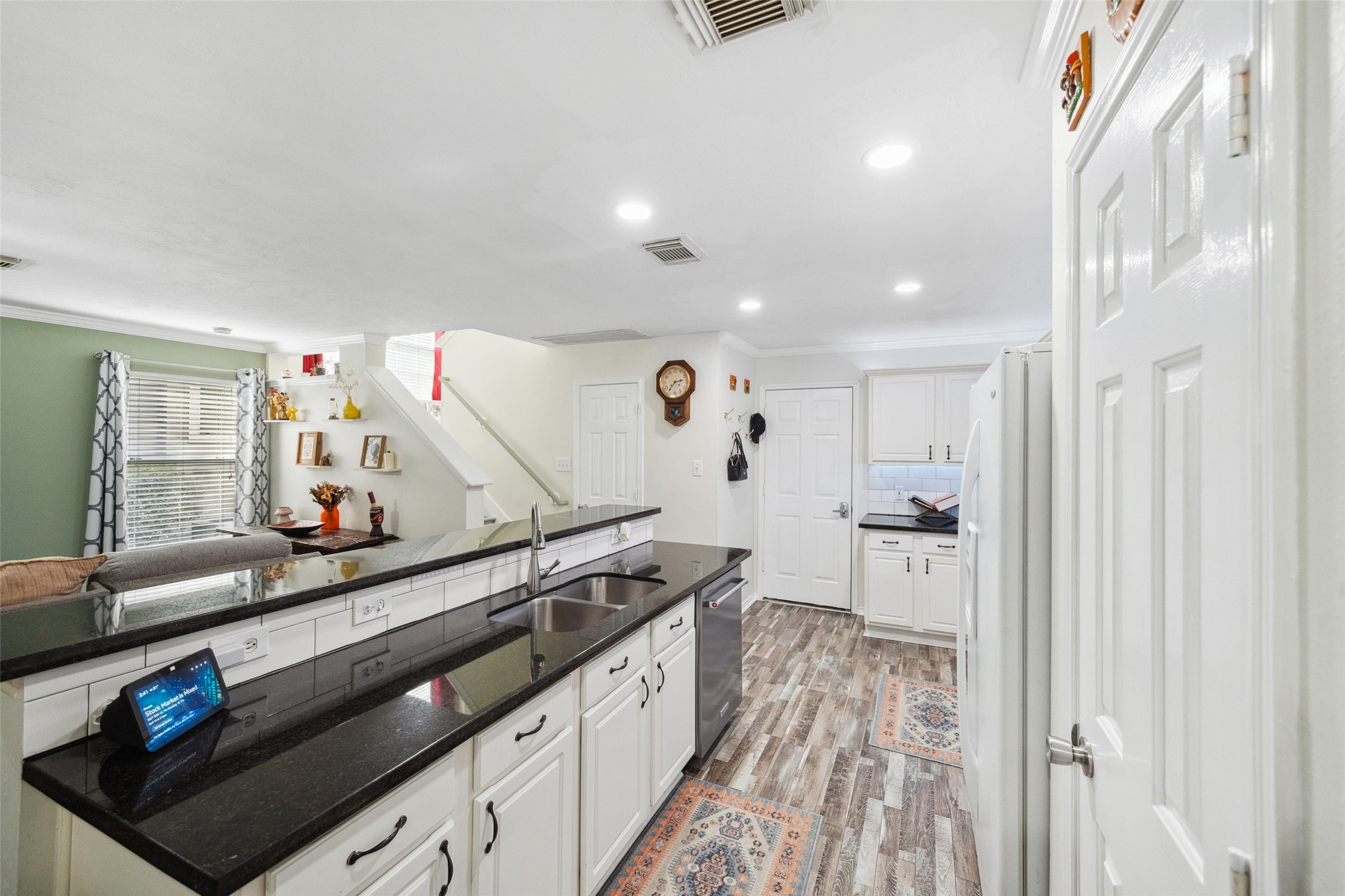 38 Wineberry Place Spring, TX 77382 - Photo 10 of 32 a kitchen with stainless steel appliances a sink and a stove