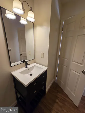 a bathroom with a sink a mirror and vanity