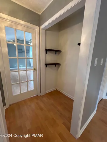 a bathroom with a granite countertop sink toilet and mirror