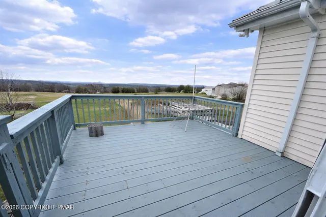 a view of a lake with houses in the back