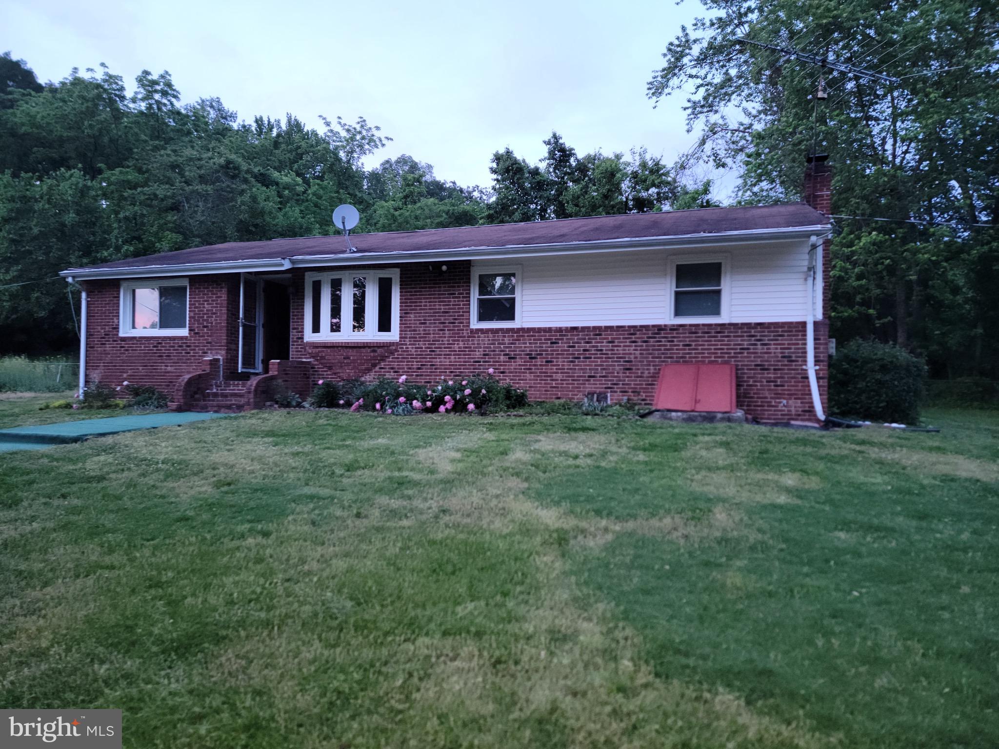 10816 Livingston Road Fort Washington, MD 20744 - Photo 1 of 26 a front view of house with yard and green space