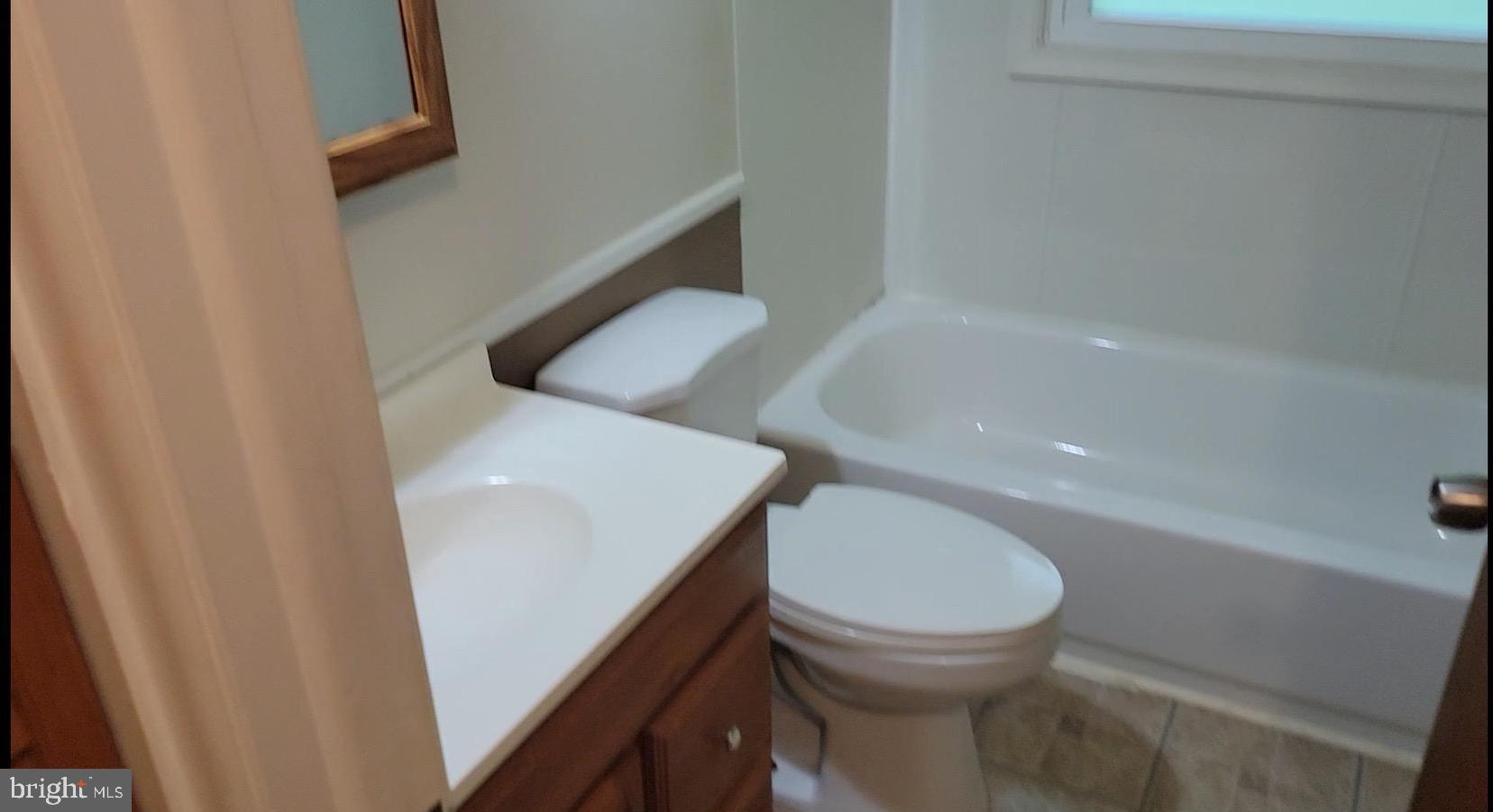 10816 Livingston Road Fort Washington, MD 20744 - Photo 23 of 26 a bathroom with a toilet and a sink
