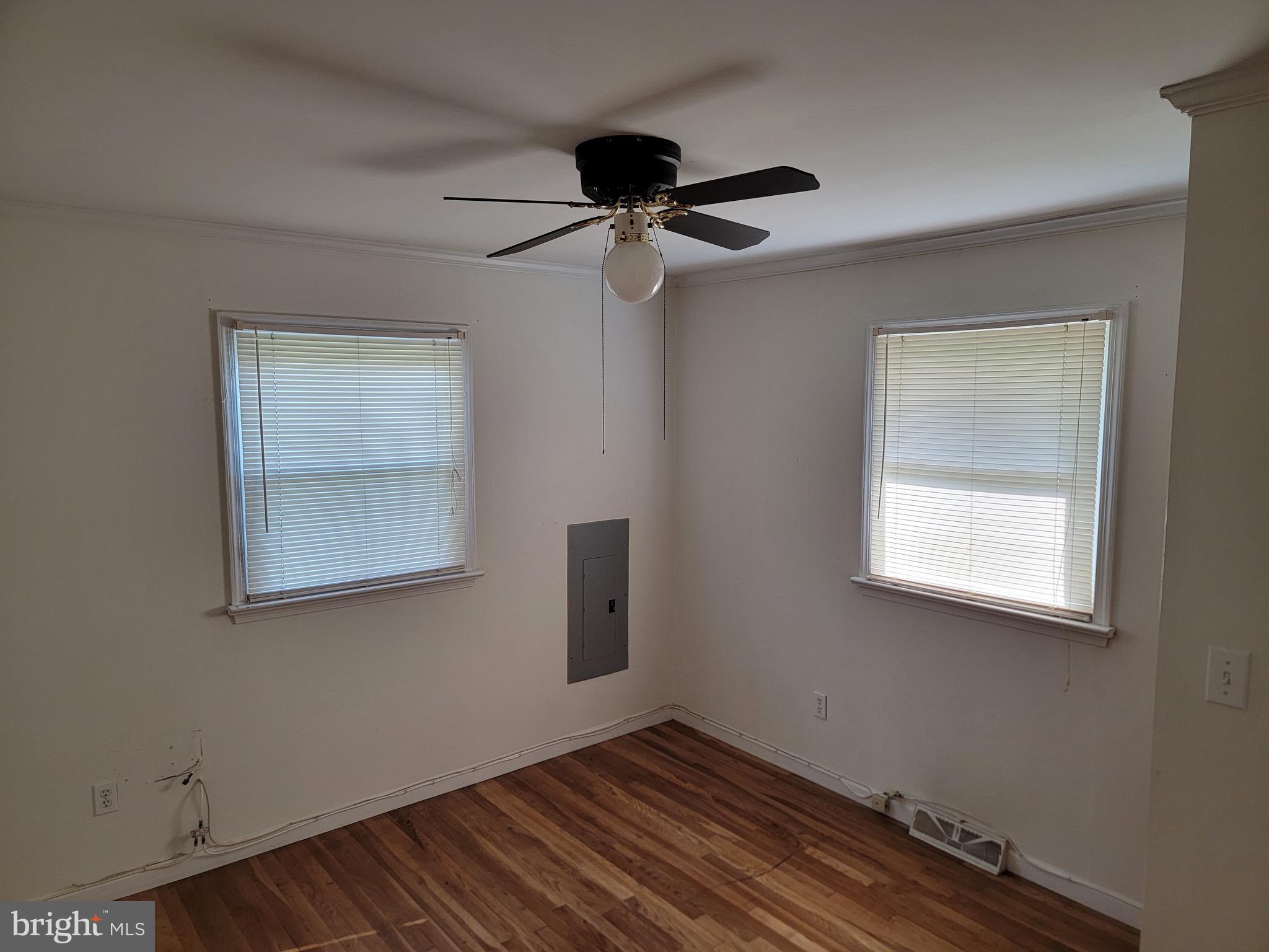 10816 Livingston Road Fort Washington, MD 20744 - Photo 8 of 26 an empty room with a window and a ceiling fan