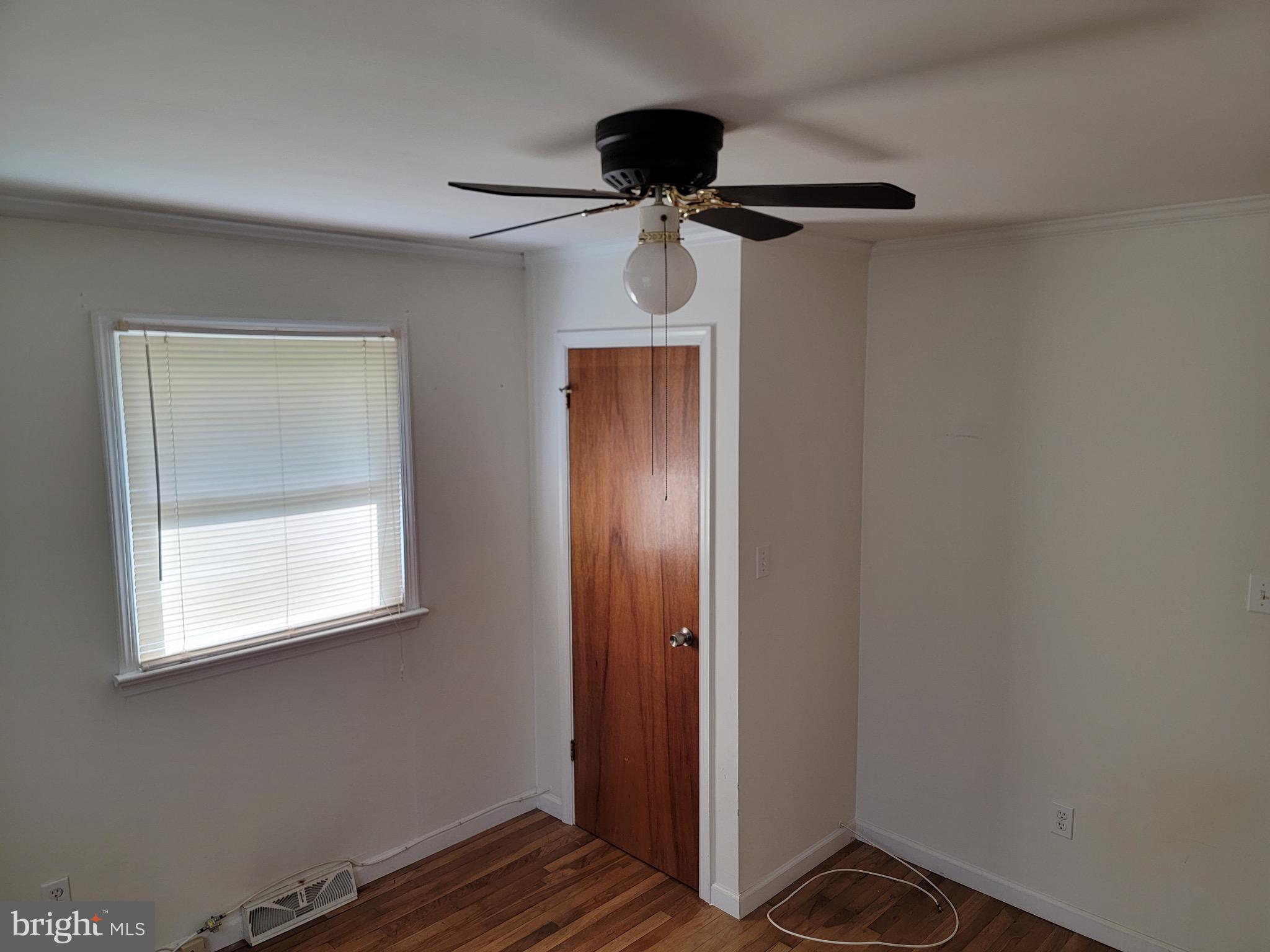 10816 Livingston Road Fort Washington, MD 20744 - Photo 9 of 26 a view of a room with wooden floor and windows