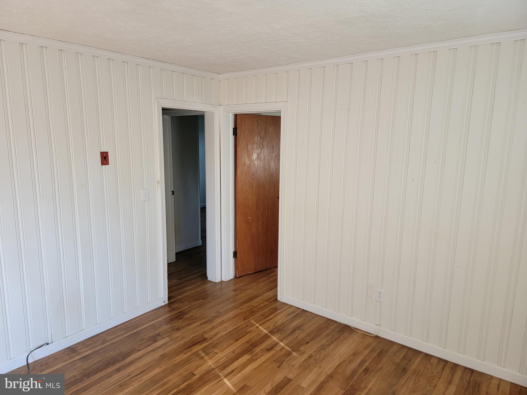 10816 Livingston Road Fort Washington, MD 20744 - Photo 10 of 26 a view of an empty room with wooden floor