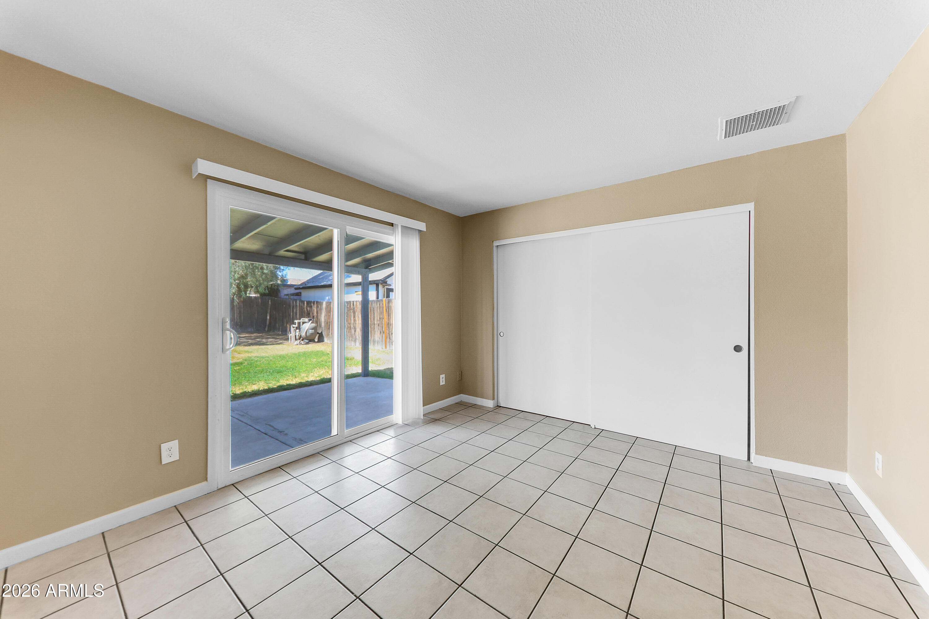 4723 East Vineyard Road Phoenix, AZ 85042 - Photo 17 of 27 a view of an empty room and window