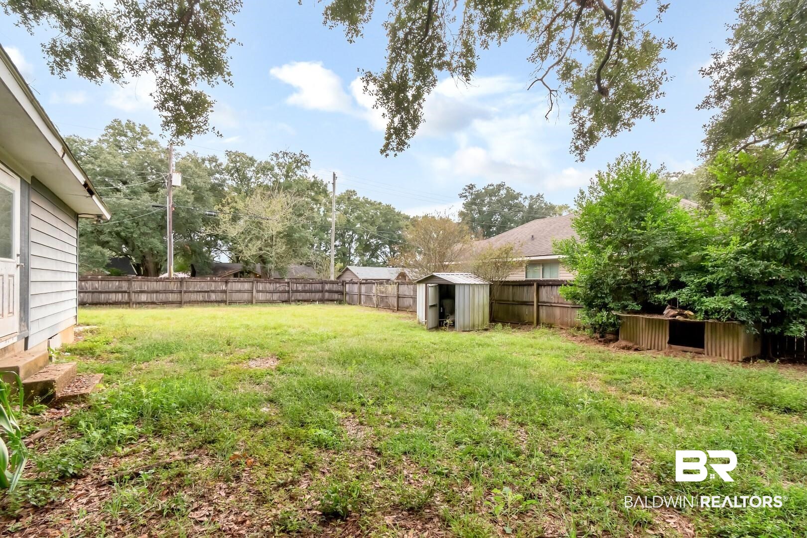2762 Hillcrest Road Mobile, AL 36695 - Photo 25 of 25 View of yard featuring a shed