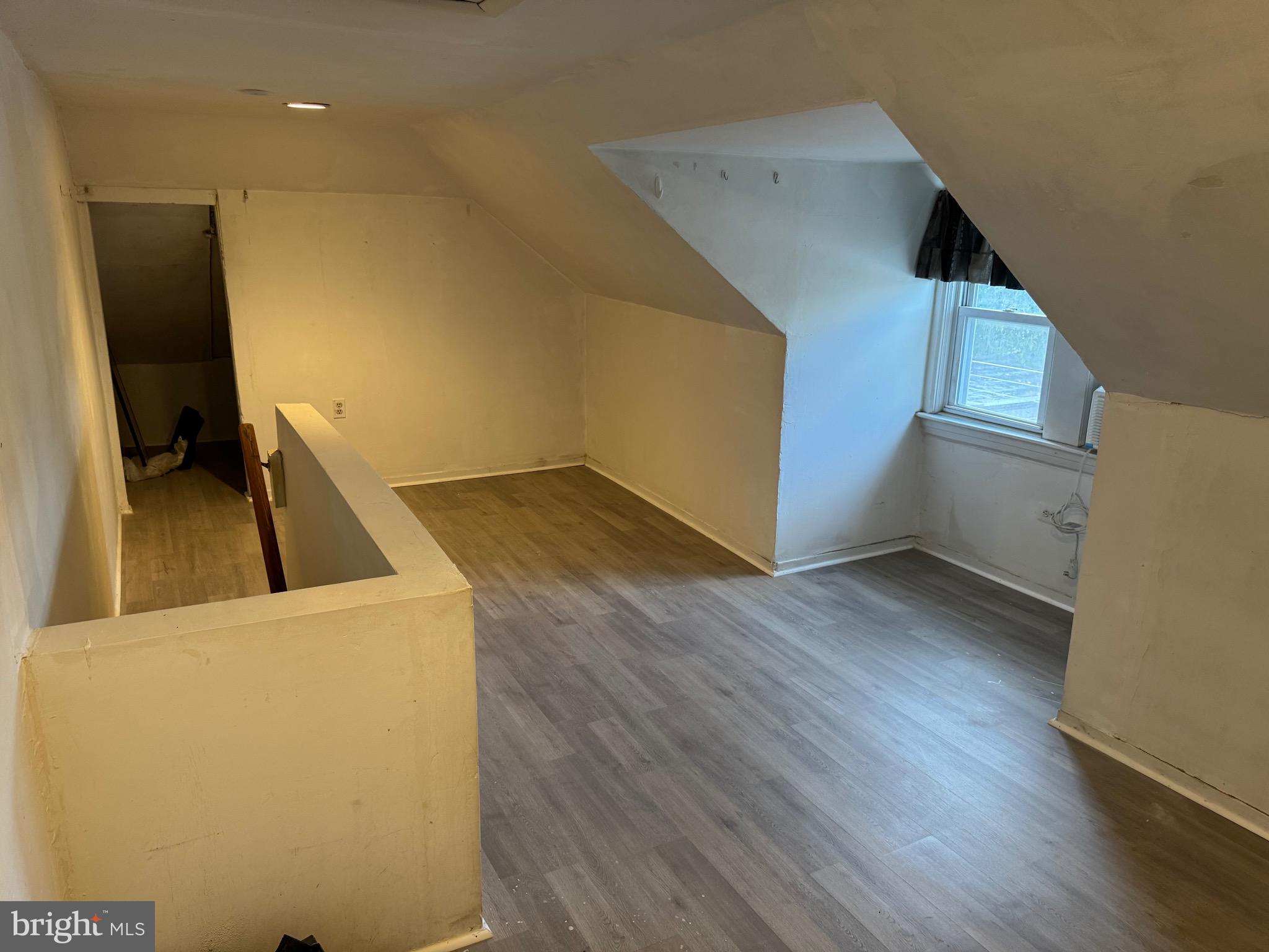 410 Laurel Road Lansdowne, PA 19050 - Photo 7 of 19 a view of a kitchen with wooden floor and cabinets