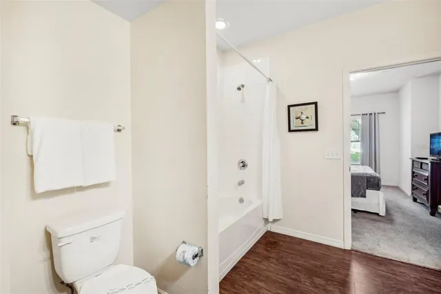 a bathroom with a toilet sink and tub