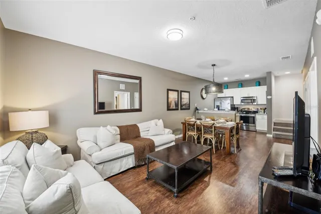 a living room with furniture and a table