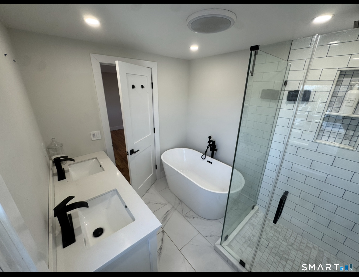 35 Knapps Highway Fairfield, CT 06825 - Photo 14 of 21 a bathroom with a sink and mirror