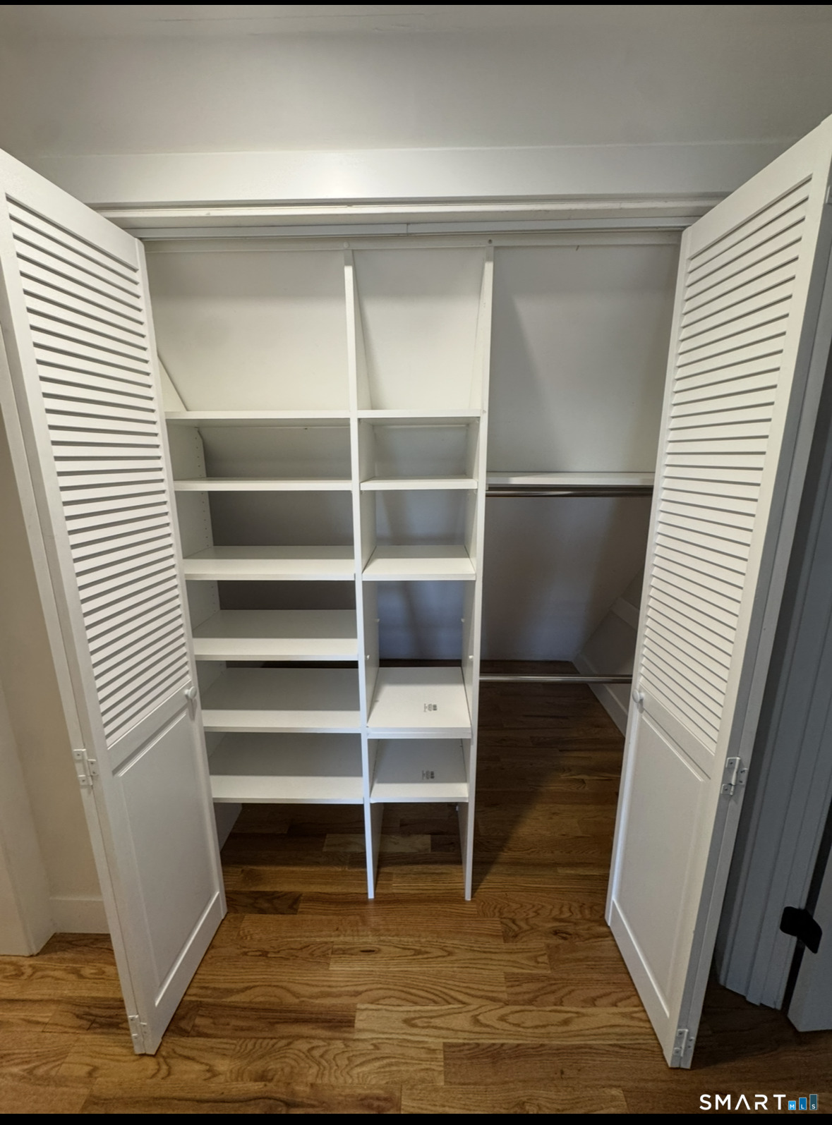 35 Knapps Highway Fairfield, CT 06825 - Photo 17 of 21 a view of walk in closet with empty racks