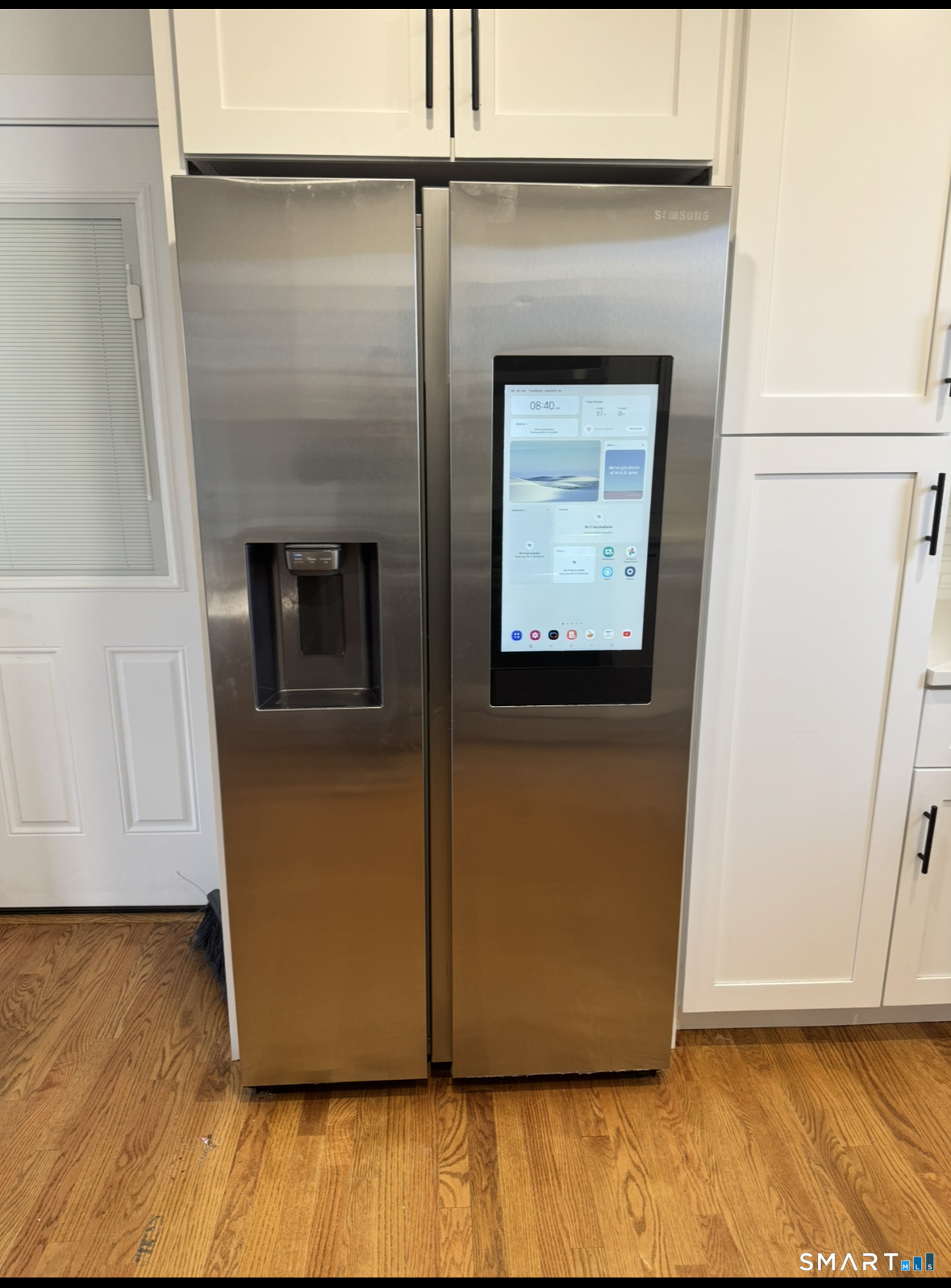 35 Knapps Highway Fairfield, CT 06825 - Photo 5 of 21 a view of washer and dryer with wooden floor