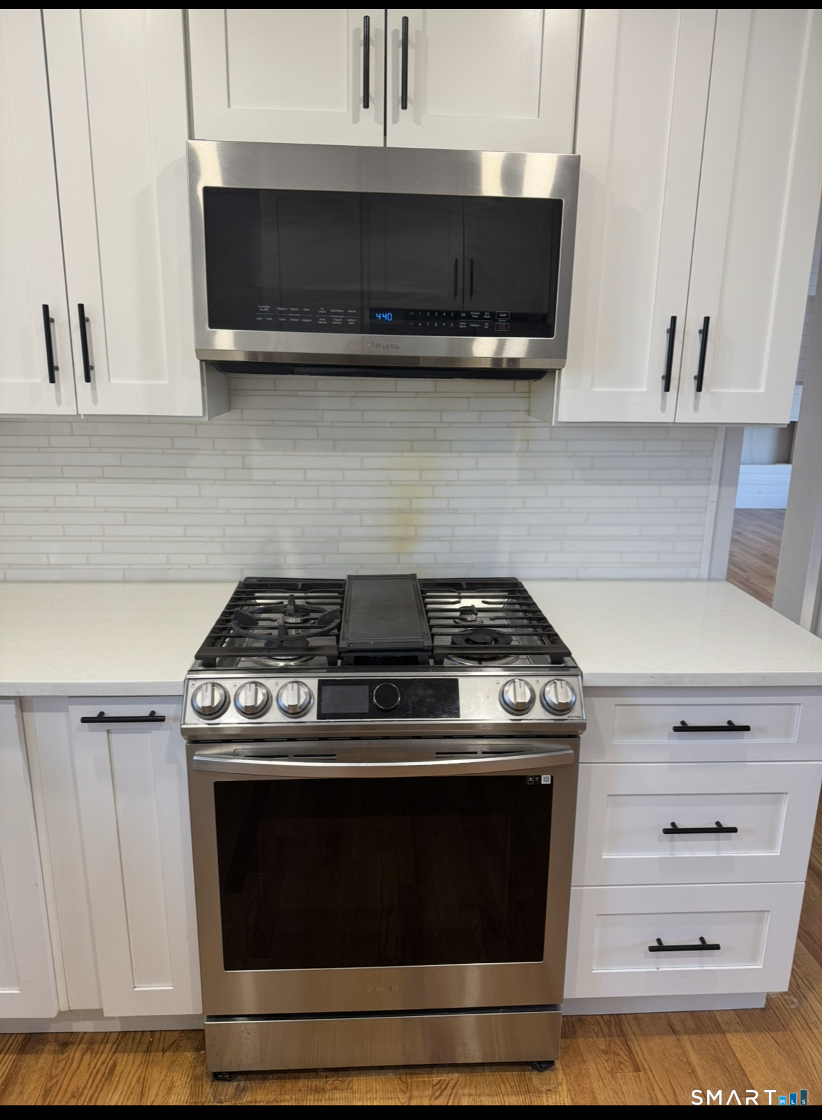 35 Knapps Highway Fairfield, CT 06825 - Photo 6 of 21 a stove top oven sitting inside of a kitchen