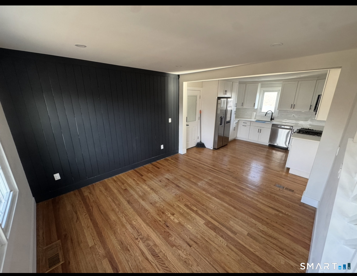 35 Knapps Highway Fairfield, CT 06825 - Photo 8 of 21 a view of empty room with wooden floor