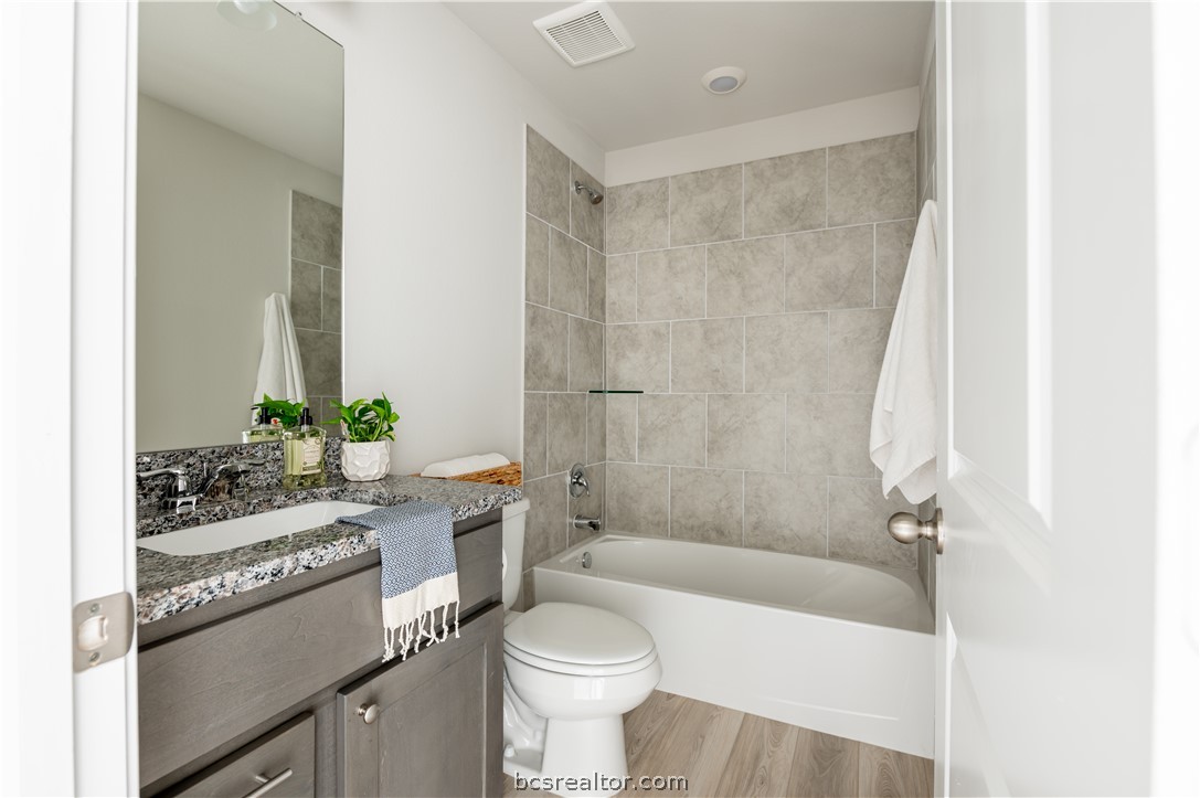 2159 Chief Street Bryan, TX 77807 - Photo 9 of 22 a bathroom with a sink a toilet and shower