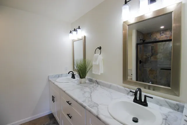 a bathroom with a sink and a mirror