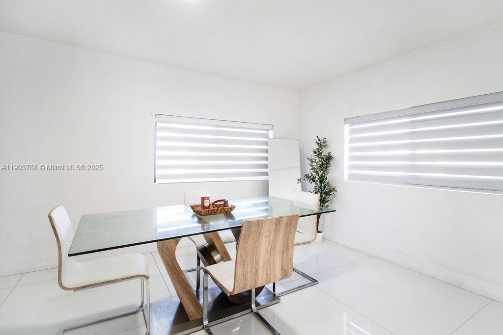 1960 Southwest 128th Court Miami, FL 33175 - Photo 11 of 32 a dining room with furniture and window