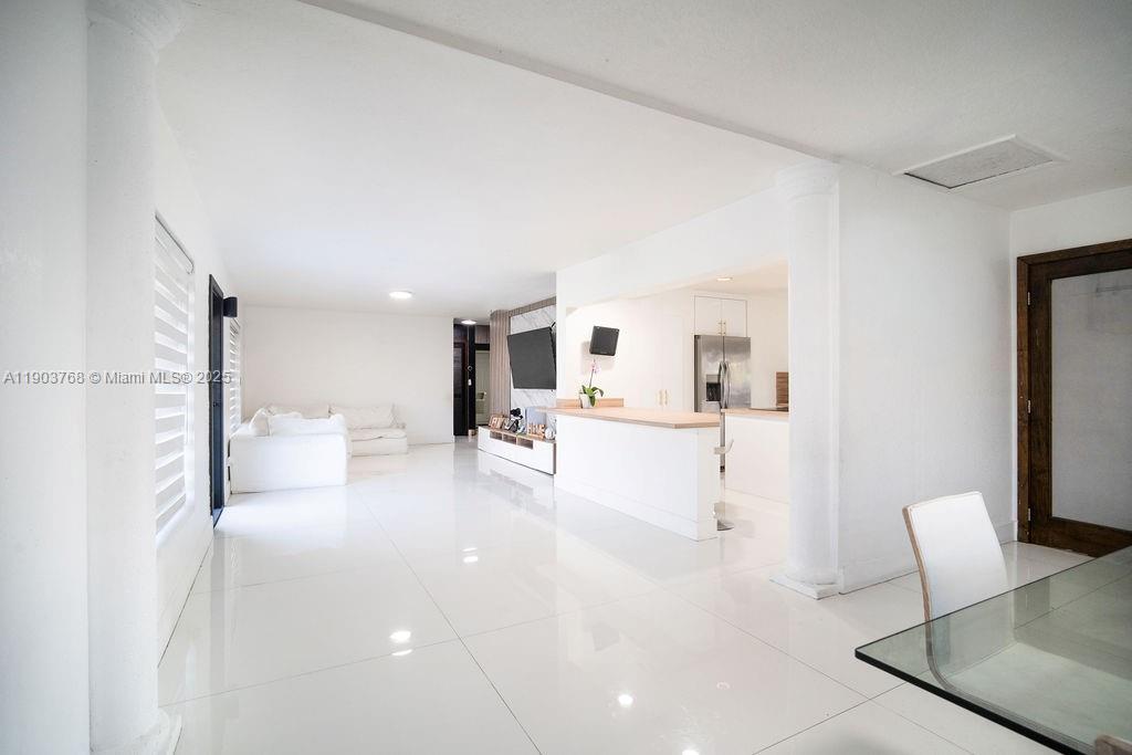 1960 Southwest 128th Court Miami, FL 33175 - Photo 13 of 32 a living room with furniture and a flat screen tv