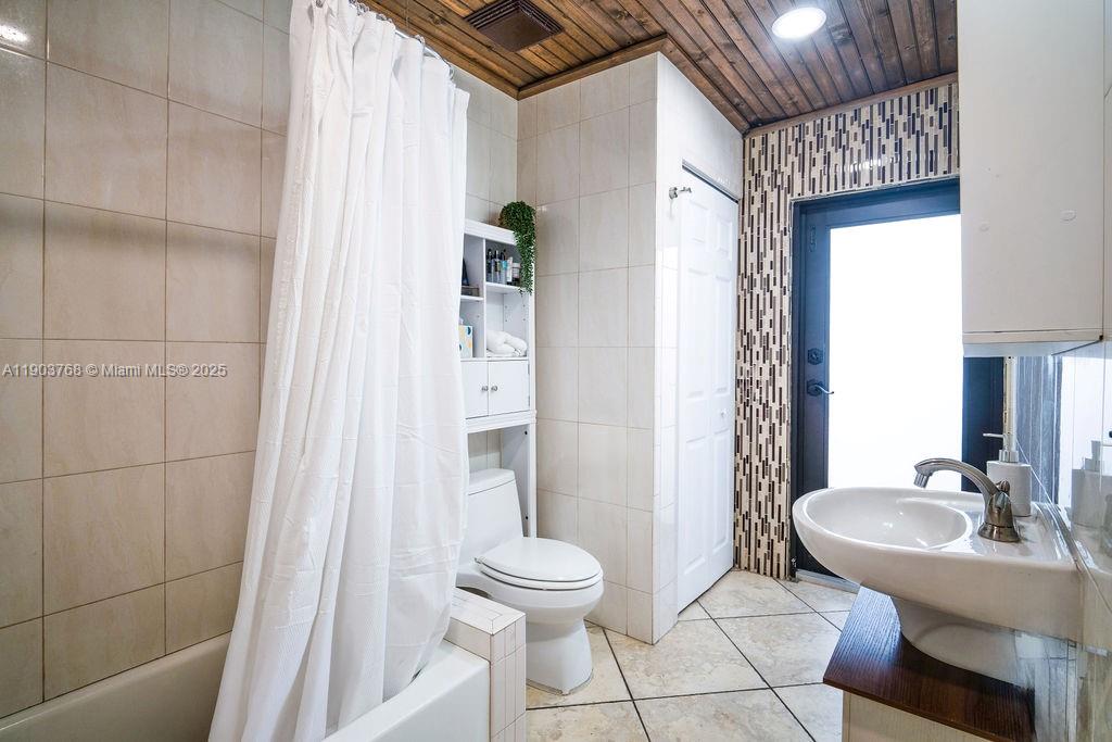 1960 Southwest 128th Court Miami, FL 33175 - Photo 18 of 32 a bathroom with a sink toilet and shower