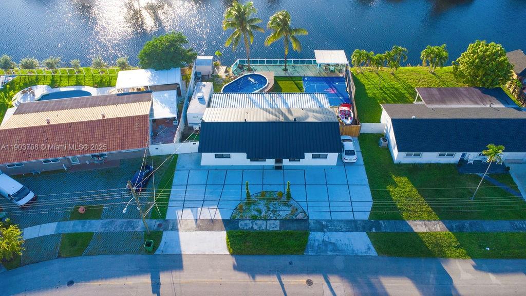 1960 Southwest 128th Court Miami, FL 33175 - Photo 2 of 32 an aerial view of a house with a garden