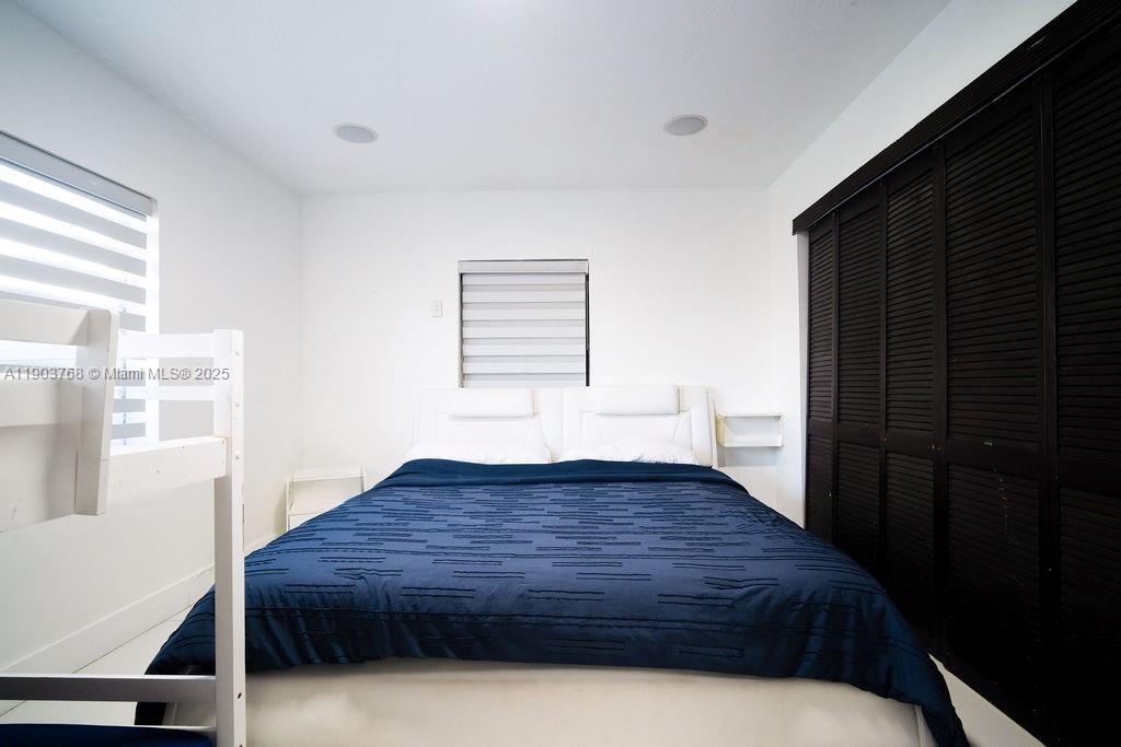 1960 Southwest 128th Court Miami, FL 33175 - Photo 26 of 32 a living room with a bed furniture and a window