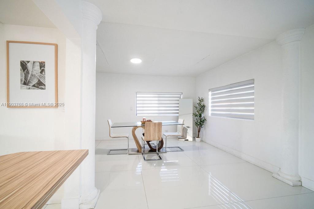 1960 Southwest 128th Court Miami, FL 33175 - Photo 7 of 32 a living room with furniture and a window