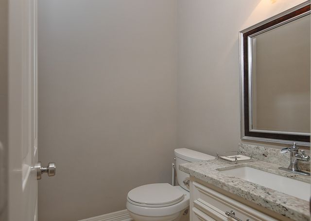 a bedroom with a bed furniture and wooden floor