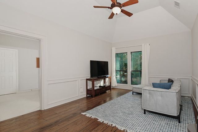 view of a room with wooden floor and white doors
