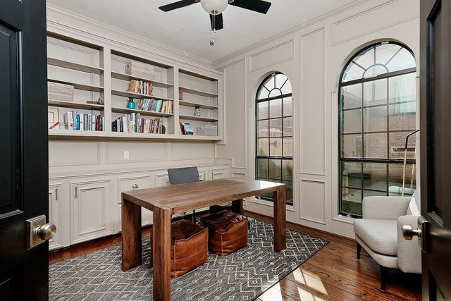 a bathroom with a granite countertop toilet and a sink