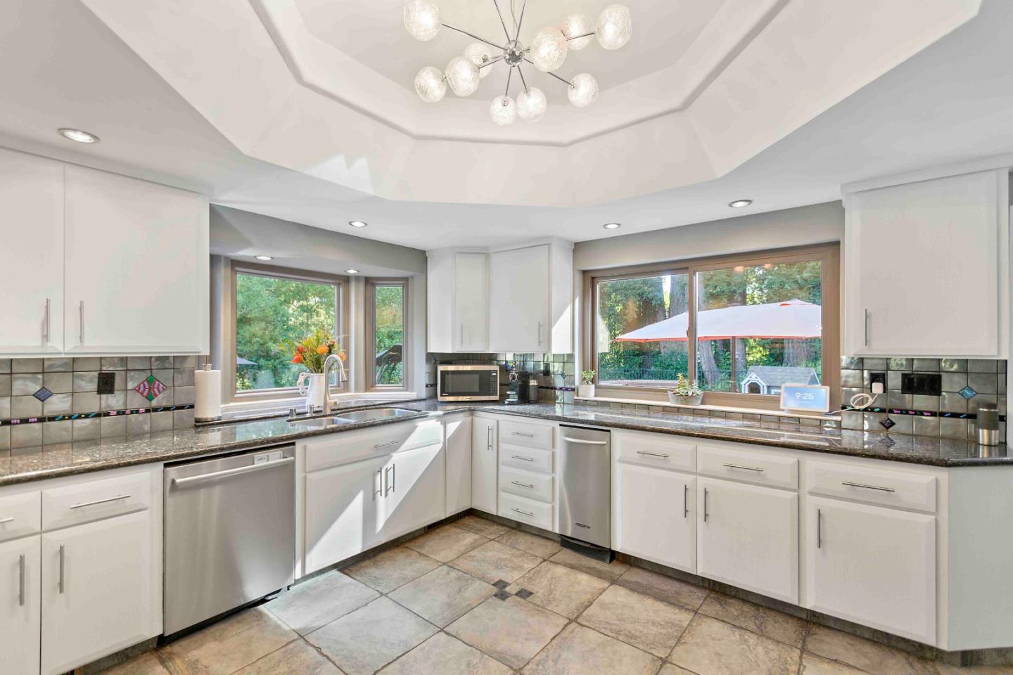 23491 Summit Road Los Gatos, CA 95033 - Photo 17 of 77 a kitchen with a sink and cabinets